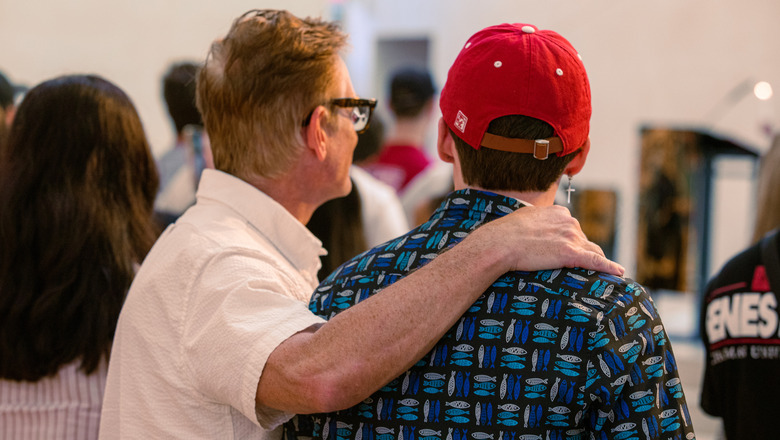 A father and son at a candle lighting ceremony