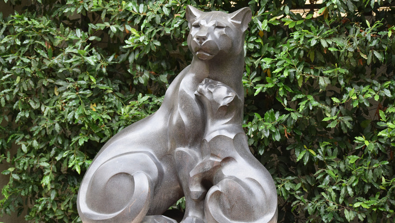 A statue of a panther with its child