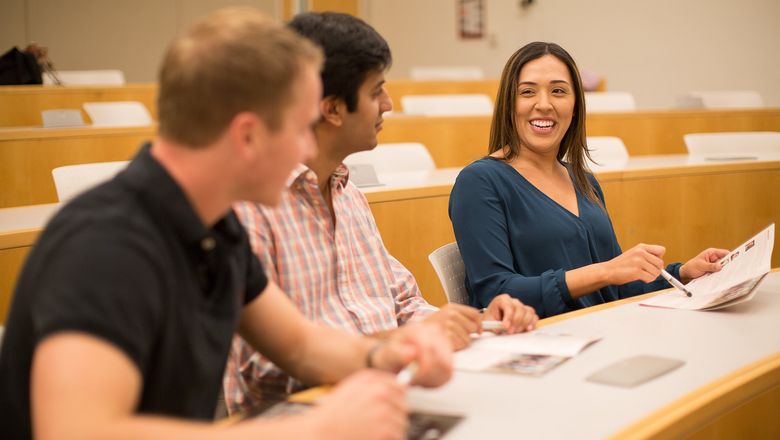 Students having a discussion in a lecture hall