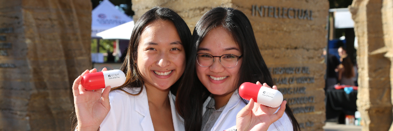 Students at a homecoming booth