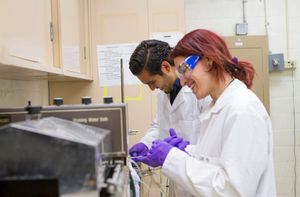 Two students work in a lab