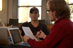 Two students engage in a discussion