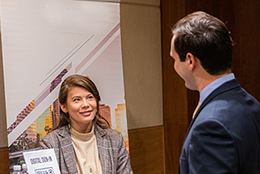 two people talking at an event