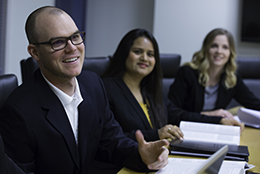 three business students in class