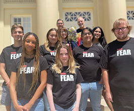 Group shot of students with their Fear shirts on in front of Memorial Hall at Chapman University