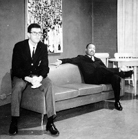 two men sitting on couch