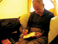 Doti Writing in Tent