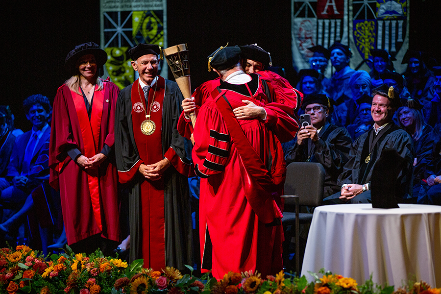 Matt Parlow Daniele Struppa hug at investiture Matt Parlow and Daniele Struppa hug at investiture