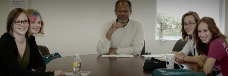 Chapman's Dr. Carmichael Peters works with students in his Honors Capstone course.