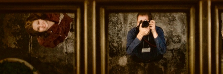 Chapman students take a photo of themselves in a mirror on the ceiling of a hotel in Phoenix, AZ.