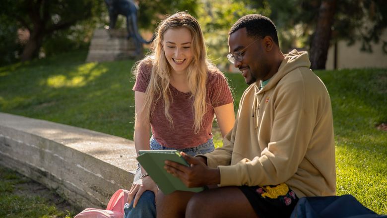 Two students working on campus