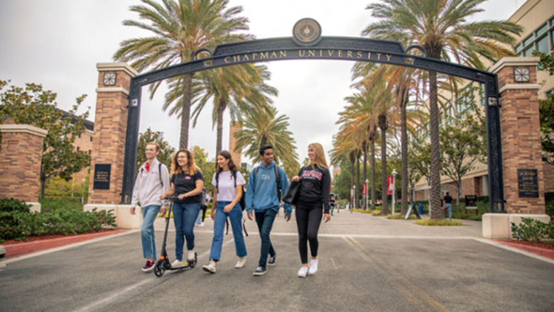 Students walking under arch