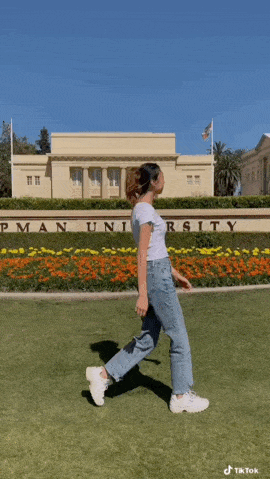Screenshot of a girl walking across campus