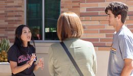 A student talking to campus guests