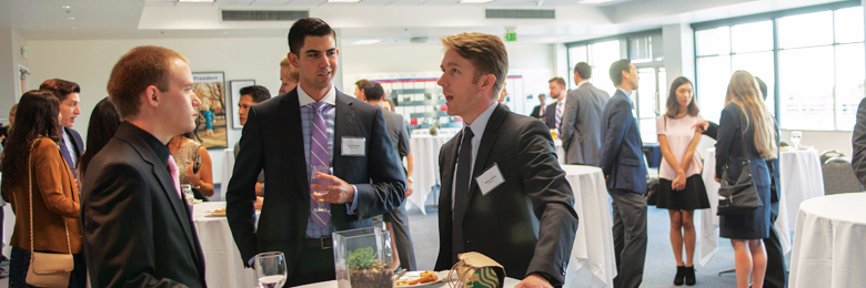Chapman business students networking at social event 