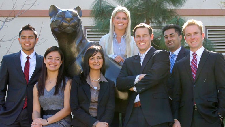 Group of business students with a panther statue at Chapman University