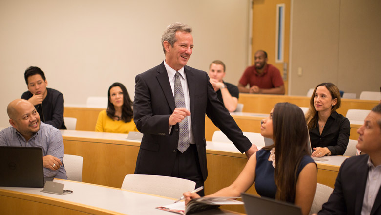 Dean Turk teaching a business class at Chapman University