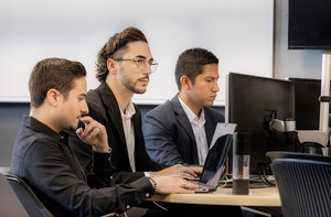 Students working on computers in a finance class.