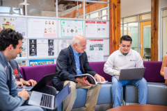 Professor in the Leatherby Center with students