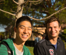 Two male students smiling at the camera
