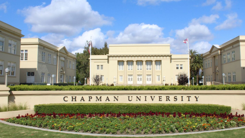 Chapman University main sign surrounded by Reeves Hall,  Roosevelt Hall, Memorial Hall, and Doti Hall