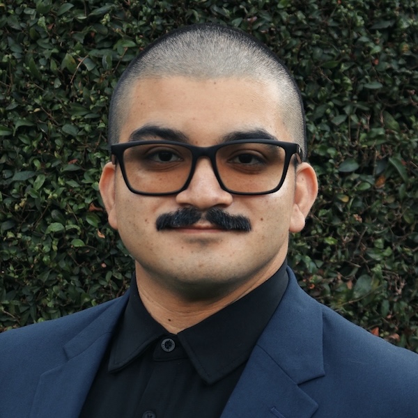 Ben Moscoso's headshot against a neutral background.