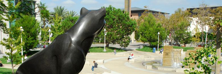 panther statue looking of student in the Attallah Piazza at Chapman University