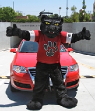 Pete the Panther in front of a car