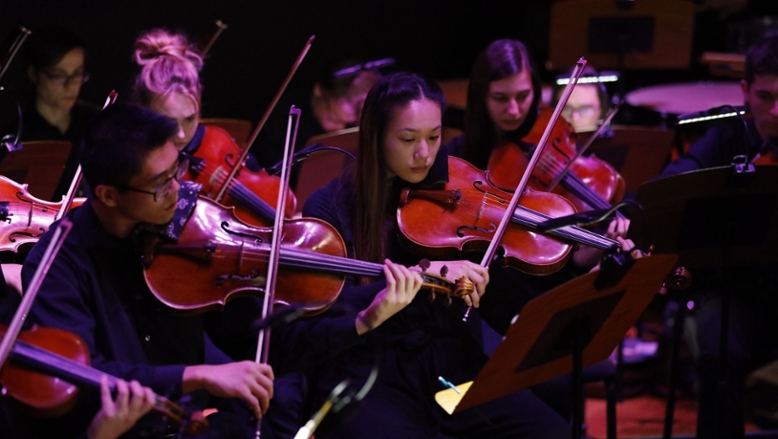 orchestra students performing