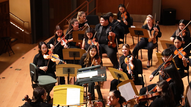 Students in The Chapman Orchestra laughing