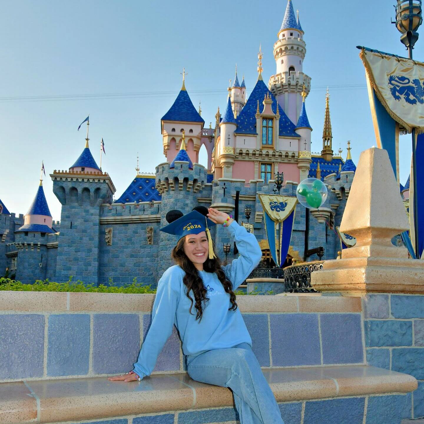 Theatre Performance student Tehani Kekuawela posing in front of the Disneyland castle
