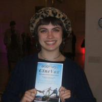 Bella Murrieta holding a CineVox pamphlet.