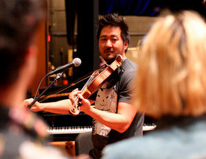 Kishi Bashi leads a masterclass for Chapman strings students.