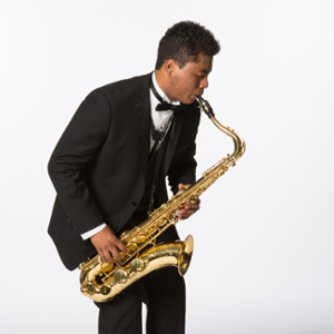 saxophone play in a black tuxedo