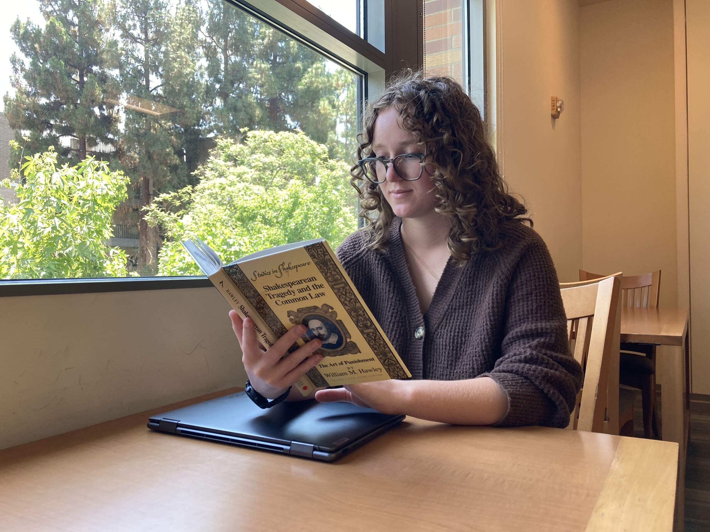 Theatre student reading about Shakespeare