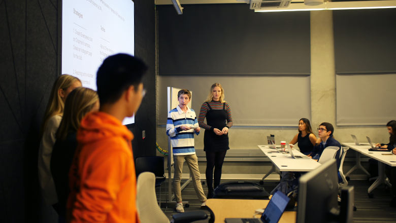 Students giving a presentation in classroom
