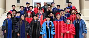 College faculty in regalia on the steps of Chapman's Reeves Hall