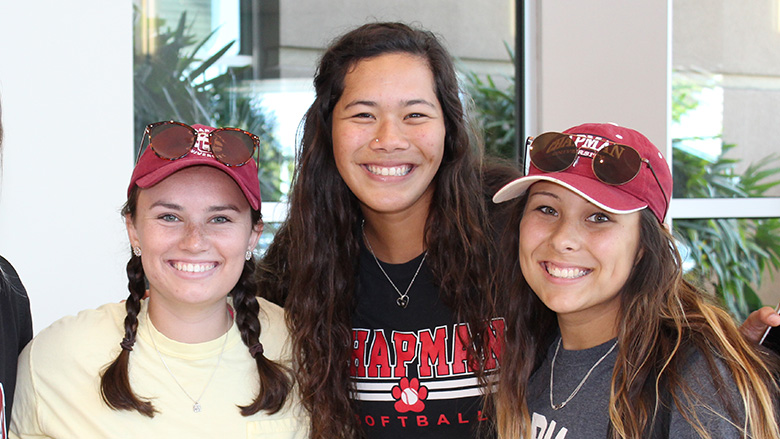 3 smiling Chapman female students