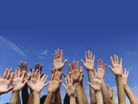 Raised hands with sky background
