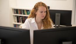 Student working on two computers