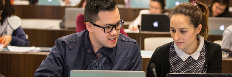 students studying on their laptops