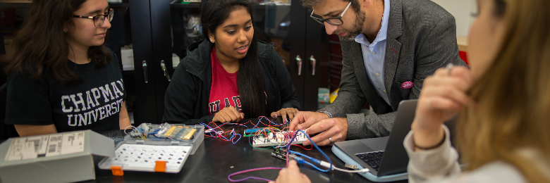 Chapman students students work on electrical project in classroom
