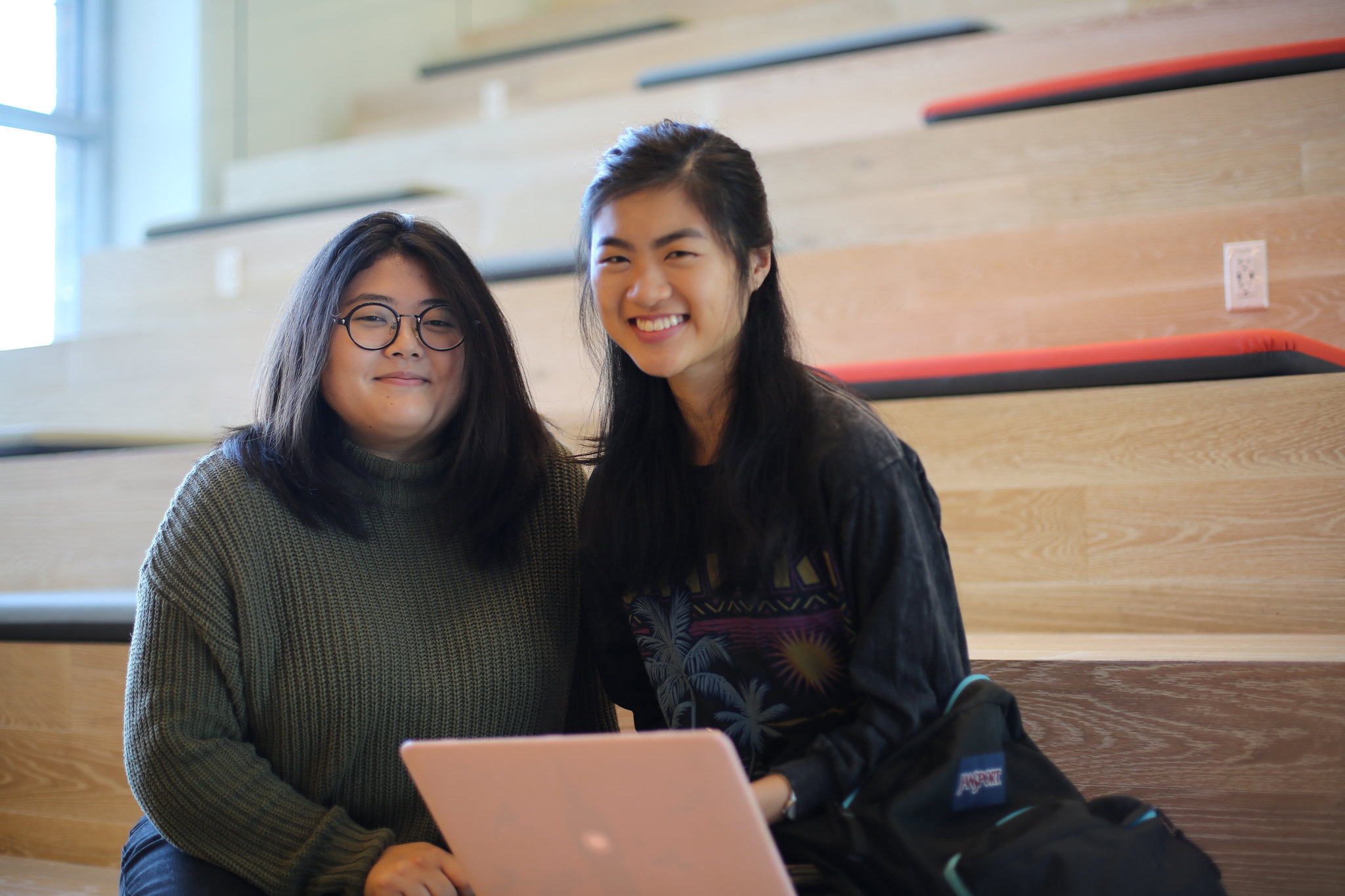 Two international students smiling