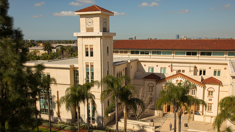 A Fowler Professor in discussion with a student