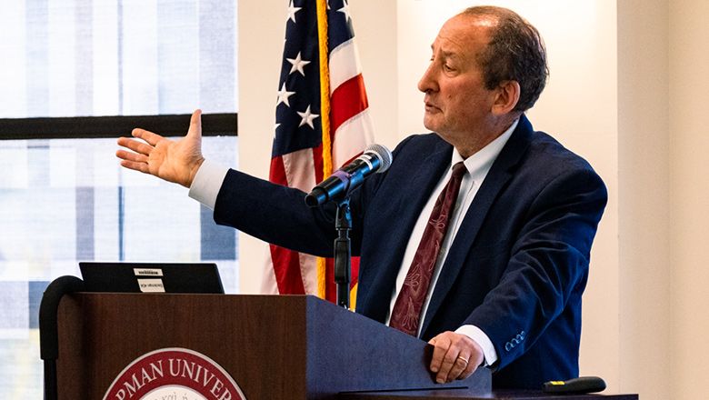 Fowler School of Law professor presenting at a discussion panel