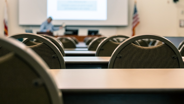 Photo of an empty classroom at the Fowler School of Law as the bar exam preparation team setting up for a session