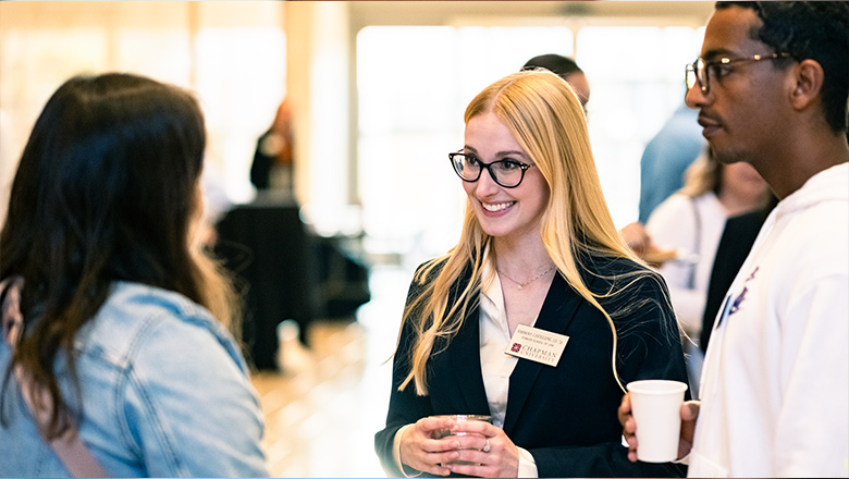 A Fowler Professor in discussion with a student