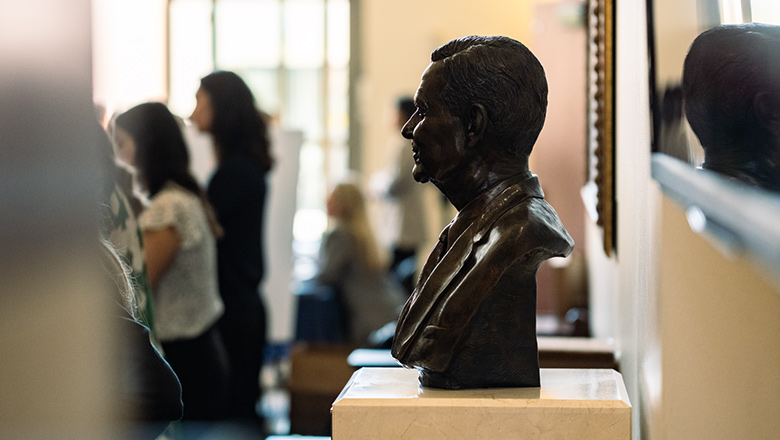 A Fowler Professor in discussion with a student