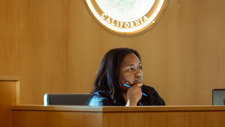 Fowler School of Law alumni judging an in house contest for students