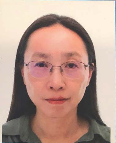 Woman with glasses and green shirt 